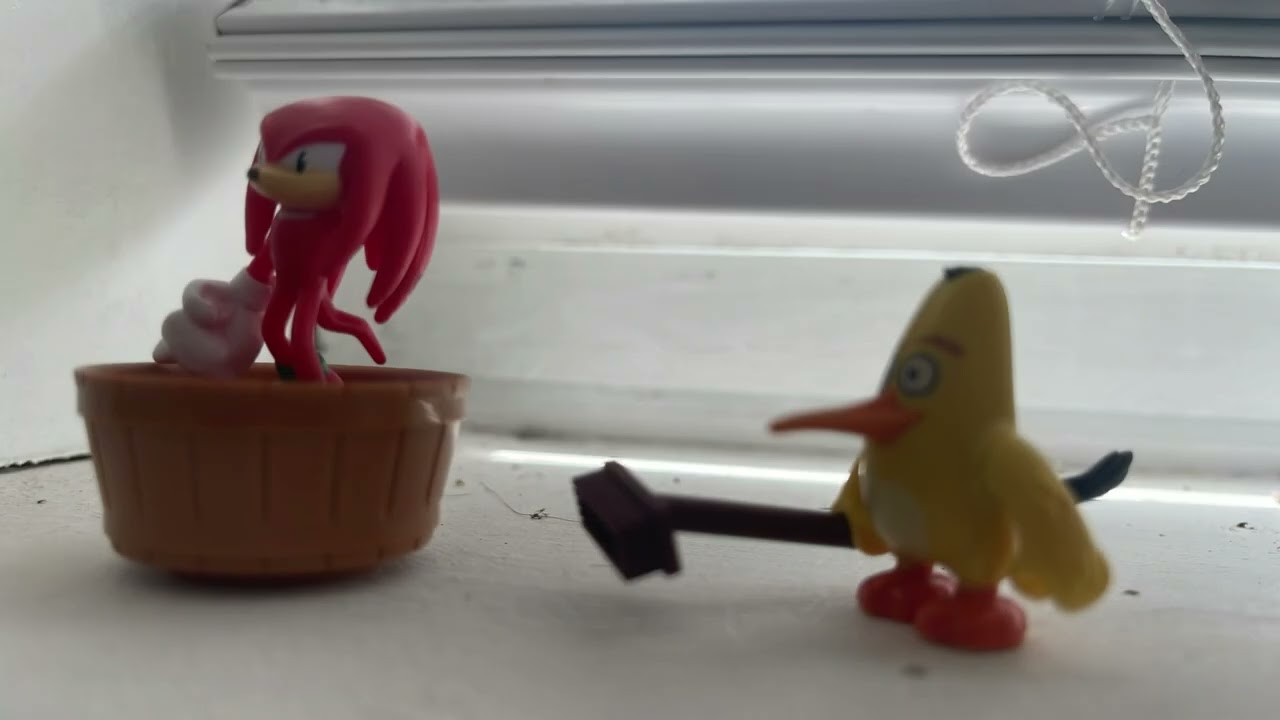 Chuck hits Knuckles with a broom