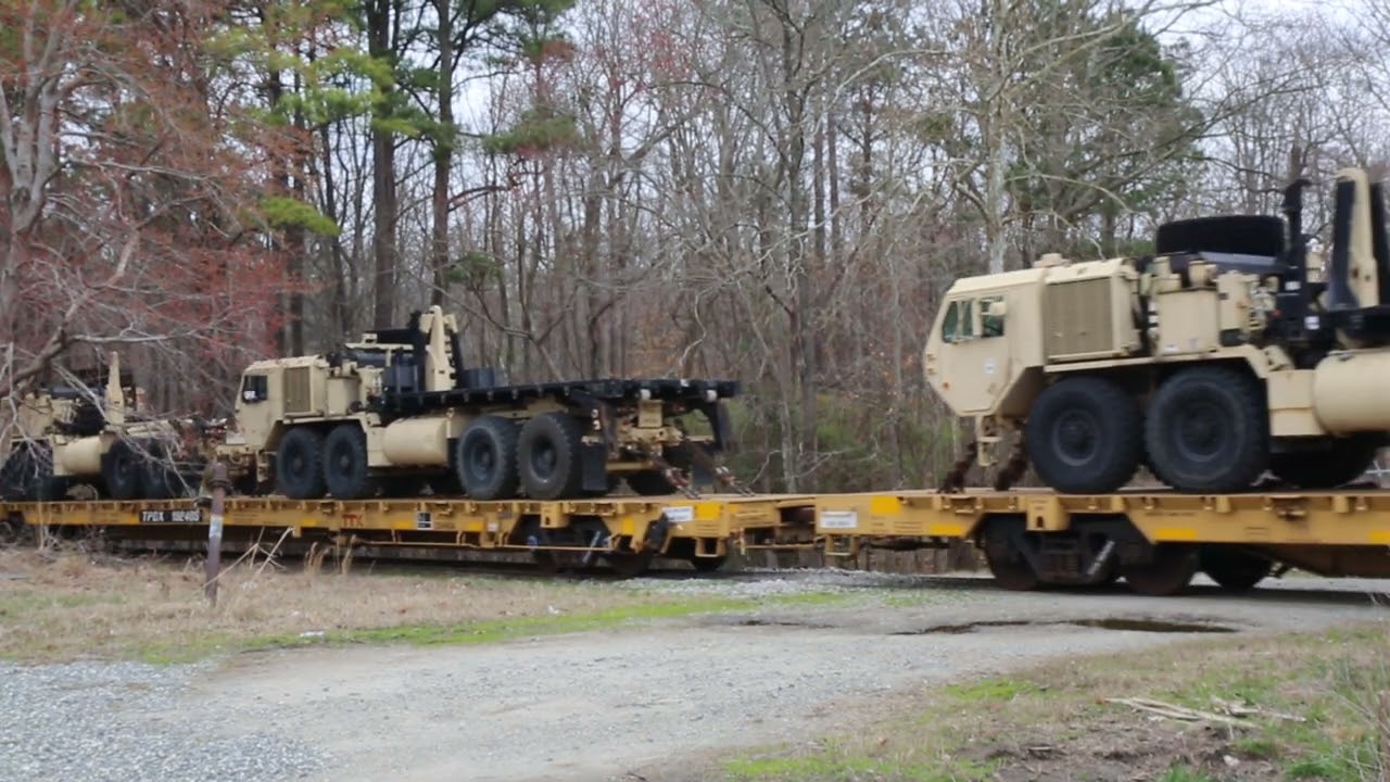 Military ARMY train leaves Fort Eustis Va at a slow crawl.