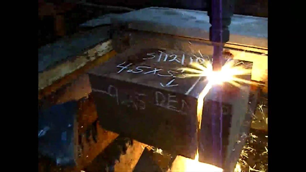 Flame cutting  thick steel with an oxy-fuel torch.