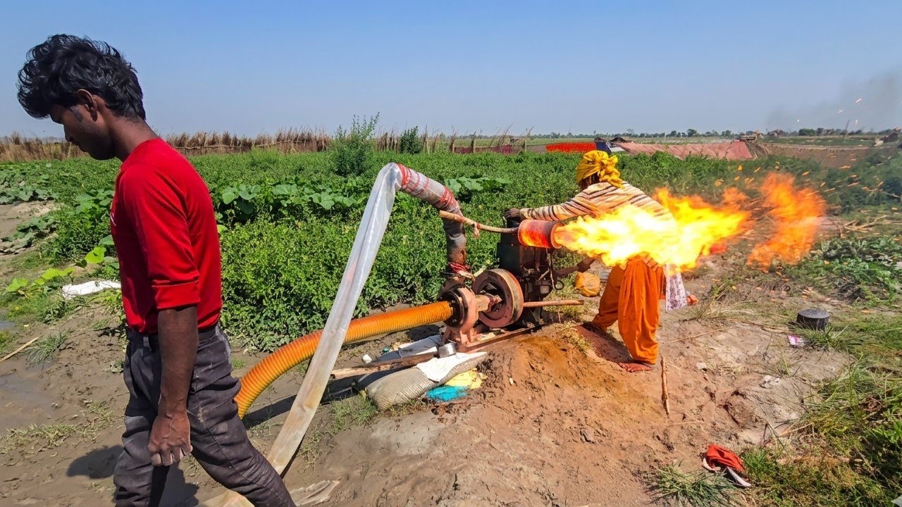 The poor farmer girl of the village started the water pump diesel engine to irrigate the crop
