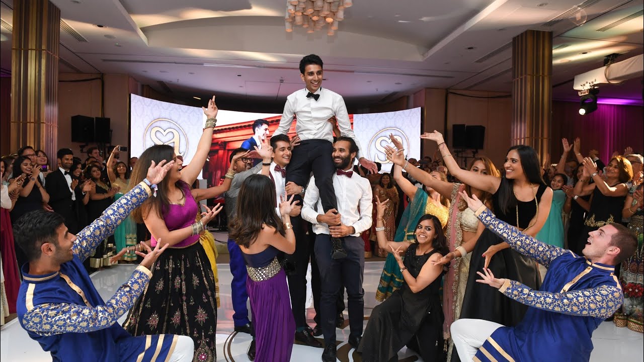 Groom surprises bride at wedding reception with an amazing Bollywood dance performance!