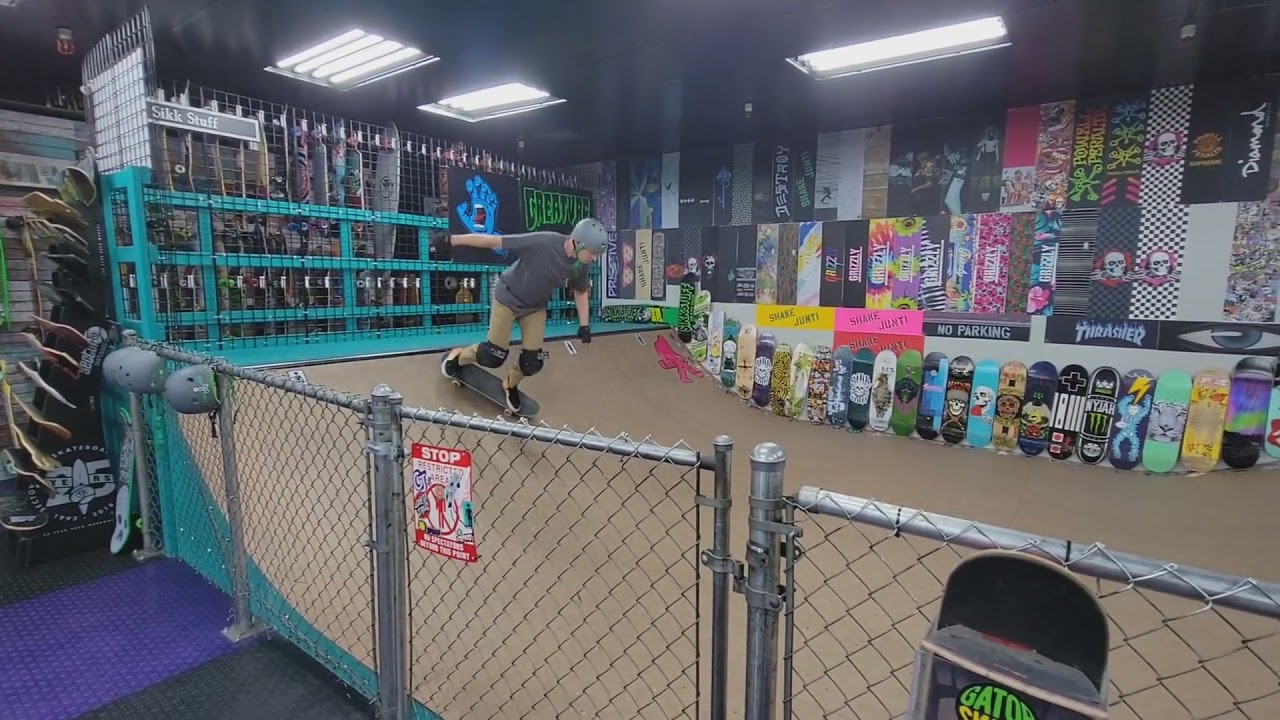 Backside rock and roll boardslide on mini halfpipe