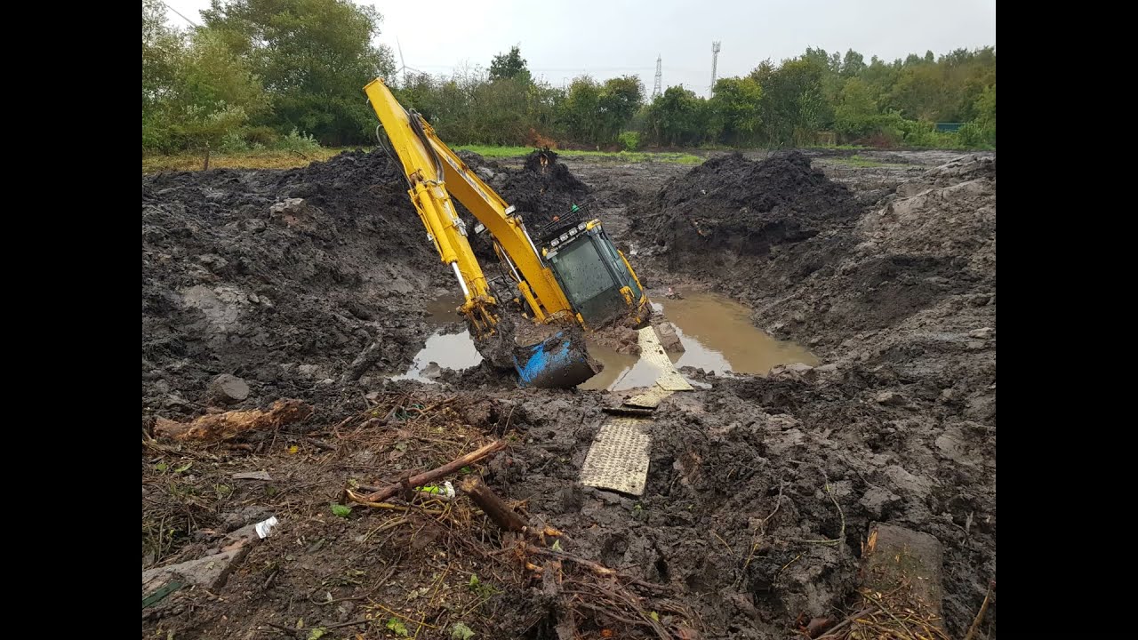 Komatsu 138 and JCB JS130 stuck in marsh ground recovered. J & R Millington