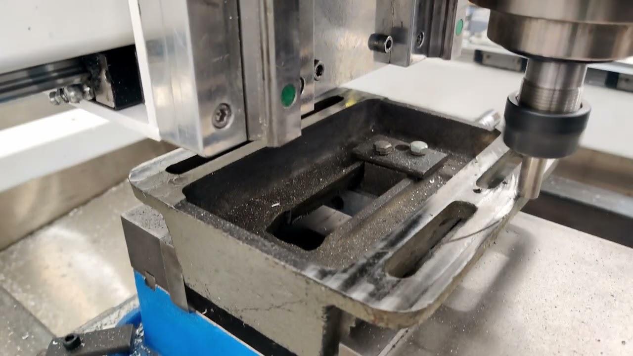 Facing the bottom of a cast iron drill press vice with BAP300r