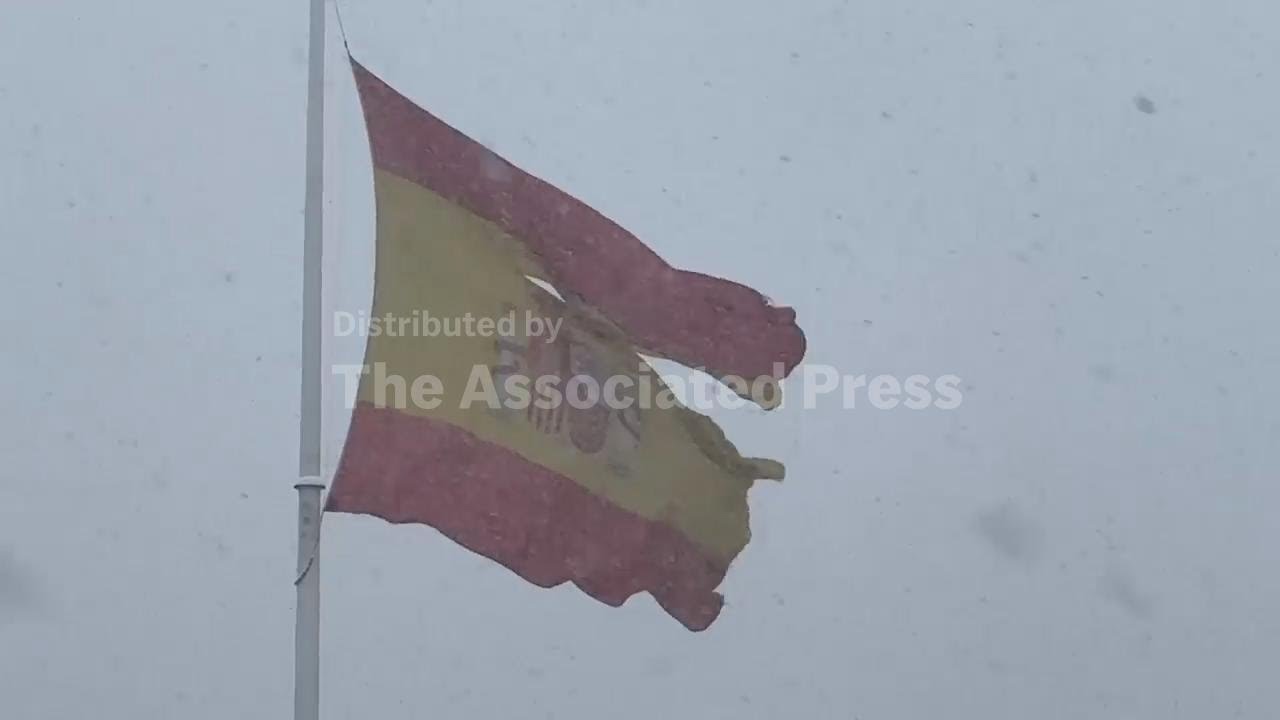 Snow and high winds whip through central Madrid