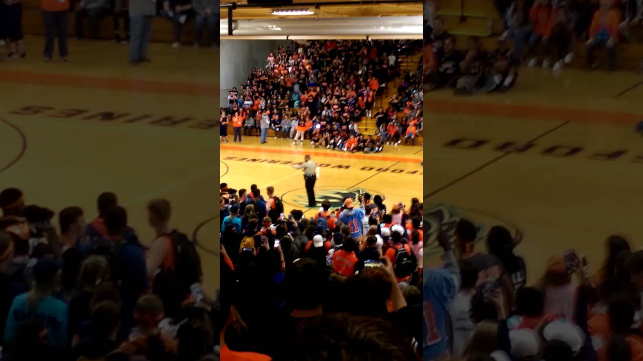 Police officer performs Formation at Pep Rally