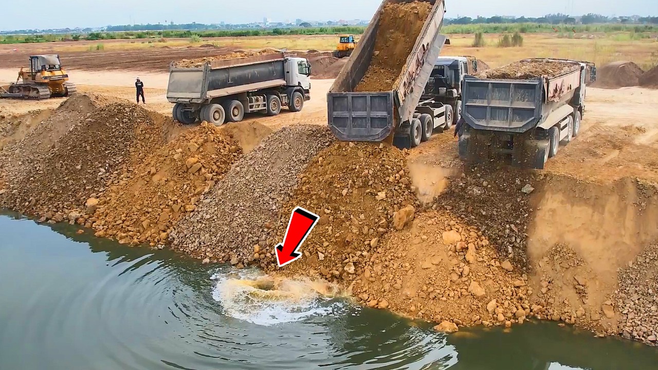So, LandSlide!!Crazy Hard Work Of Bulldozer Pushing Stones Bury The Side Of Lake With 25T Dump Truck