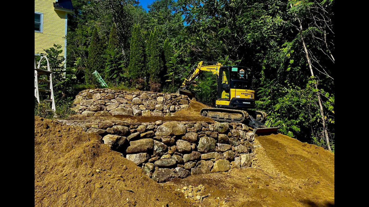 Building a Rock Retaining Wall with a Mini Excavator