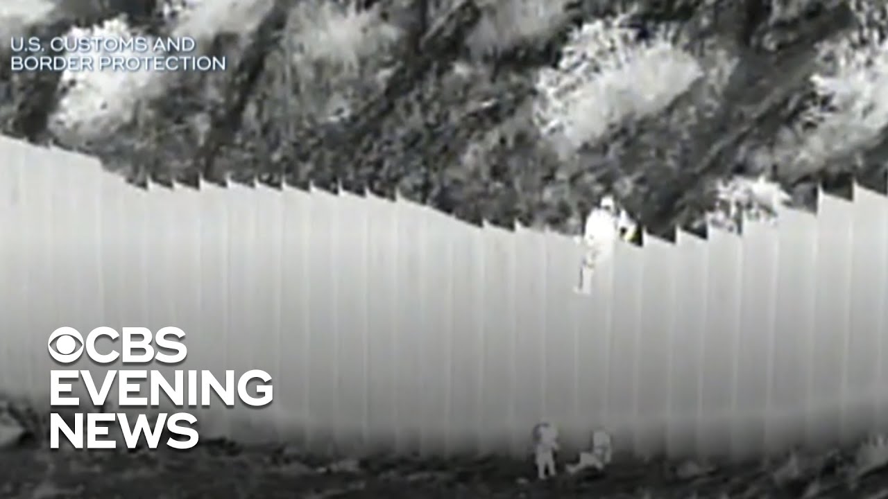 Video shows smugglers dropping young kids over border barrier
