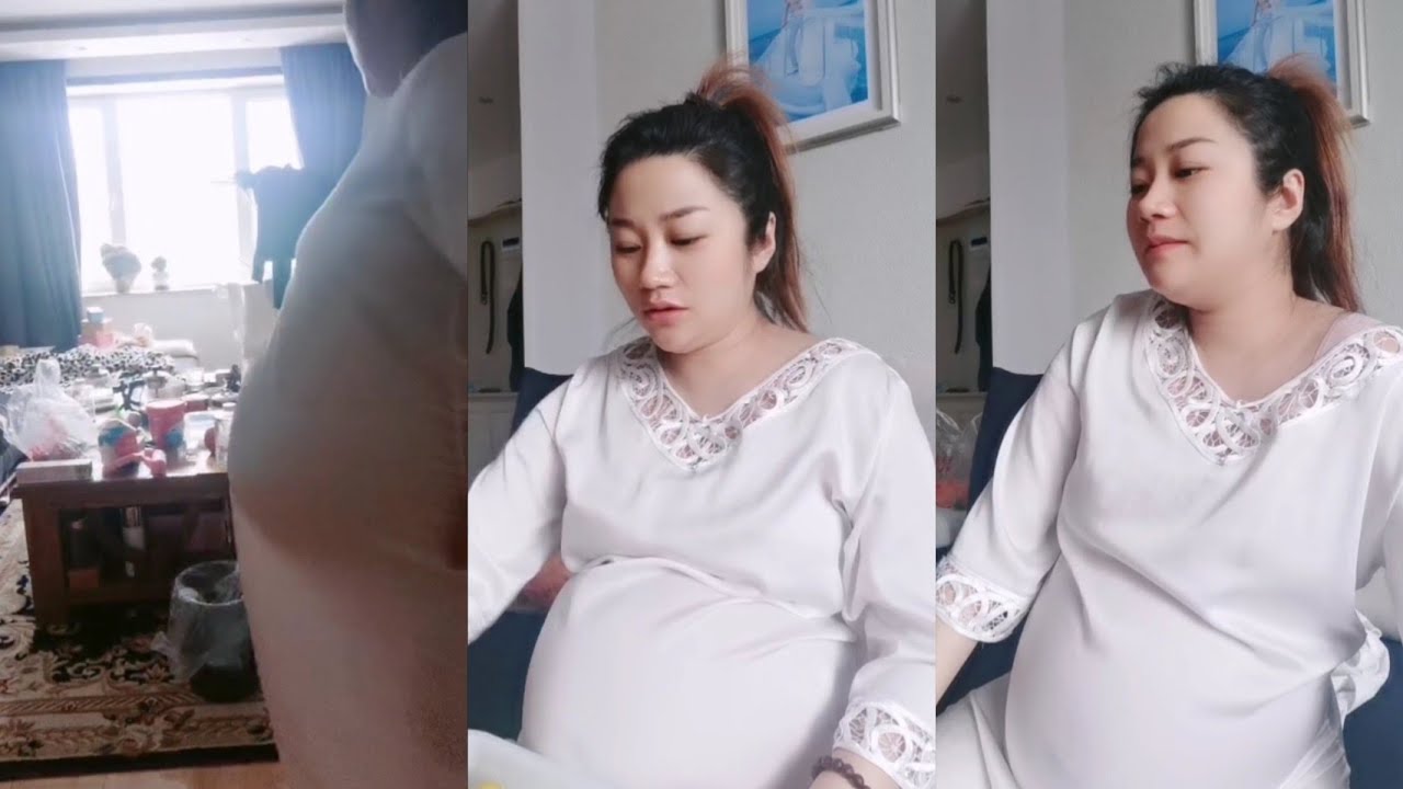 pregnant asian mom doing activities at home
