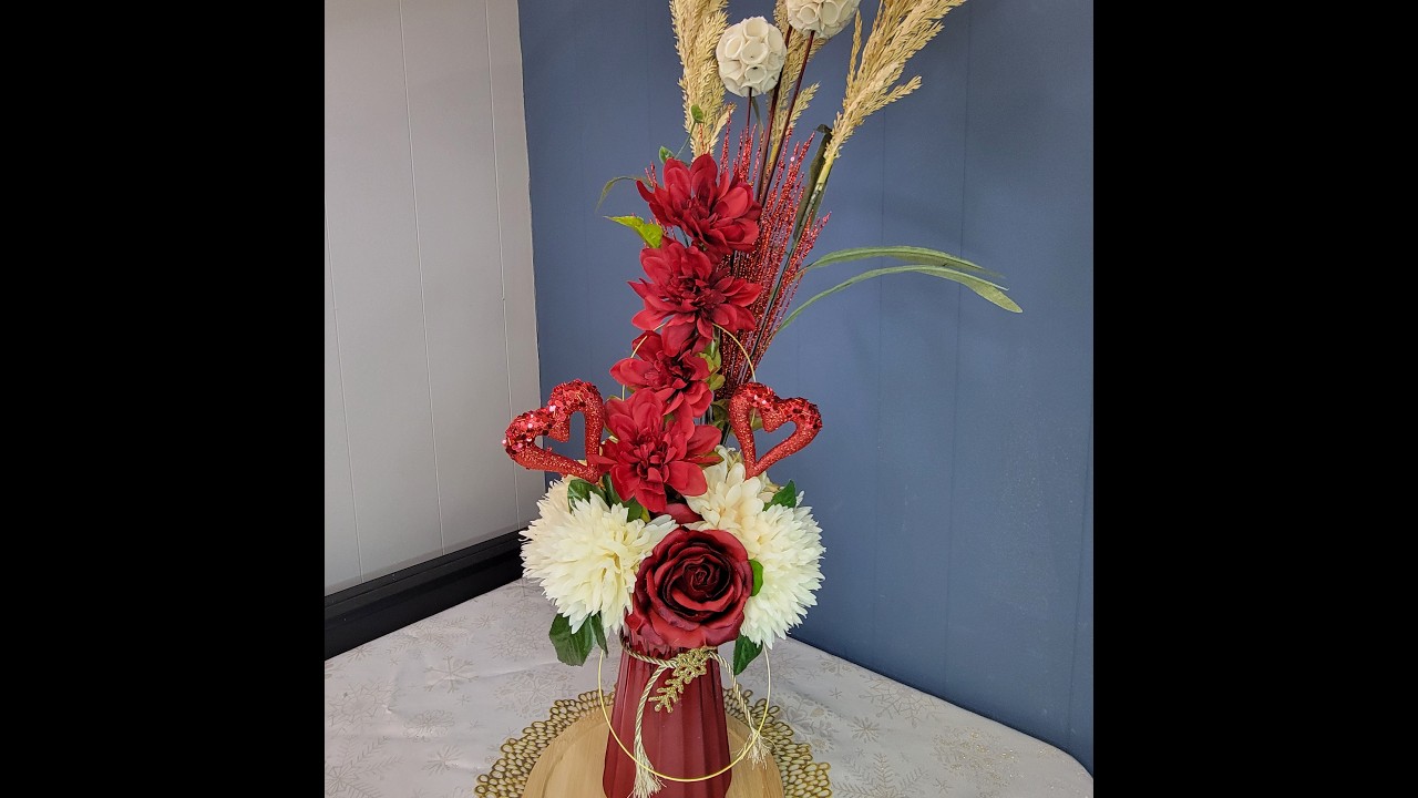 arrangement with roses and red hearts