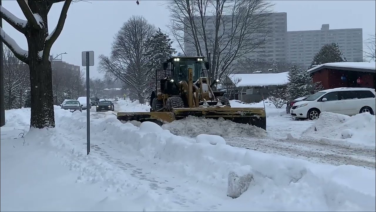 Residential Plowing with a Cat loader 950M and wing plow