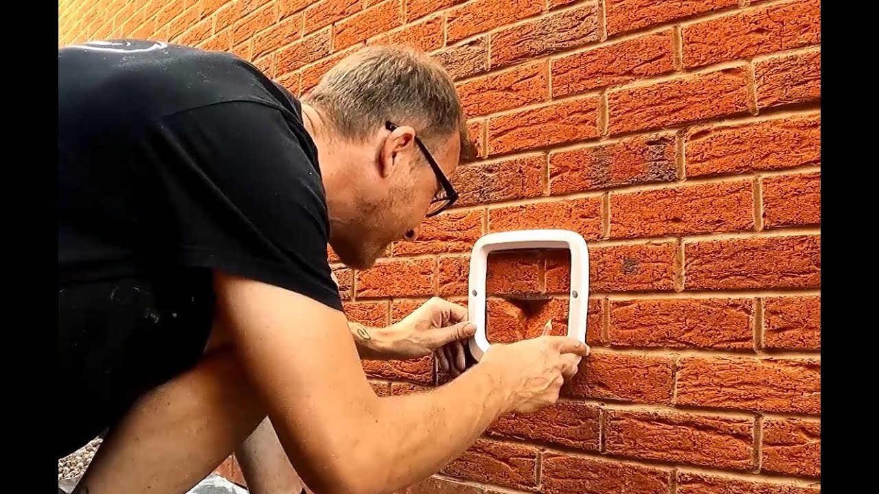 A Day fitting Cat Flaps into Windows and Walls