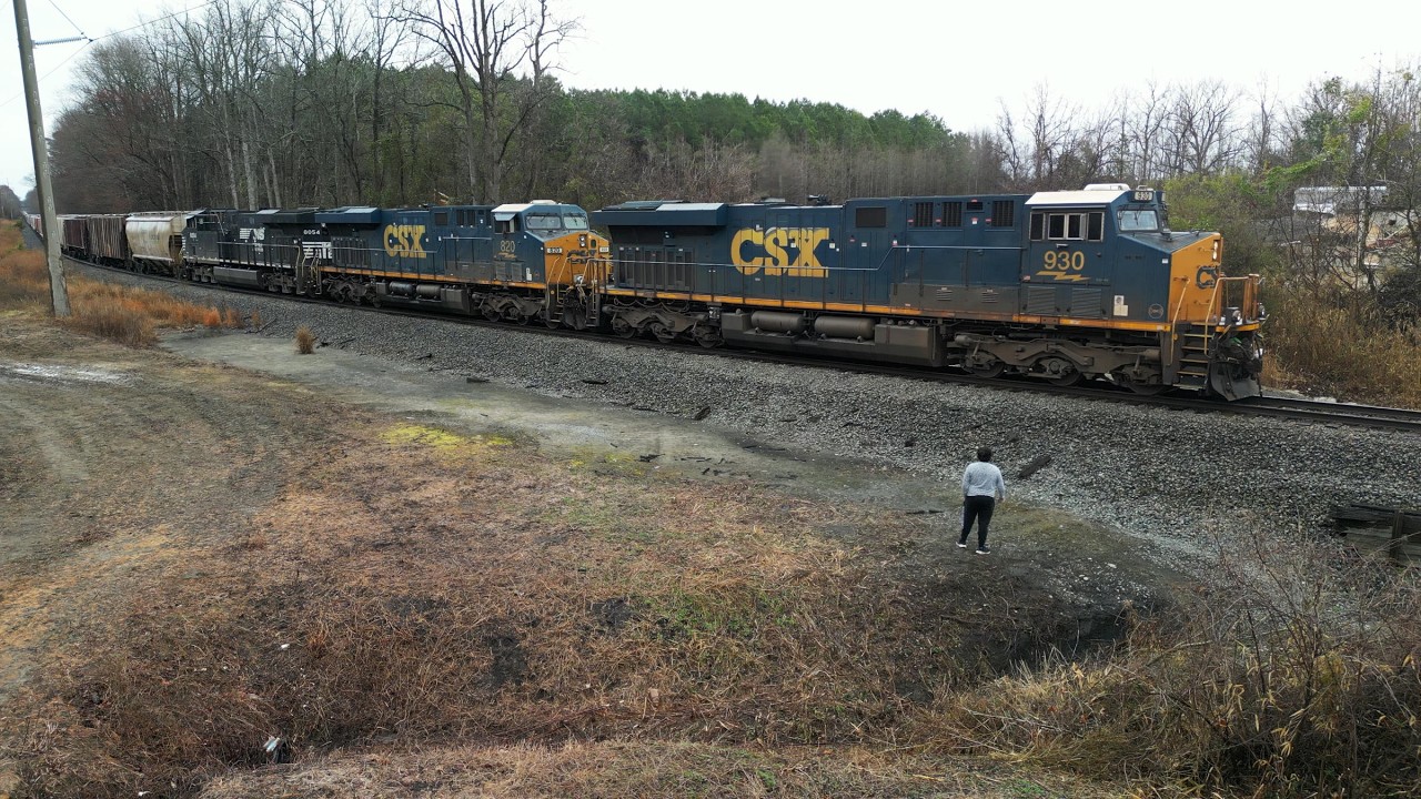 Norfolk Southern E03 phosphate unit train comes out of Nutrien Aurora mine with CSX power.
