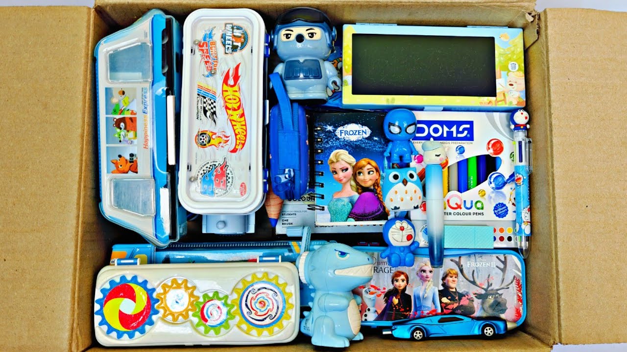 Box full of blue stationery items - Sipper bottle, Pencil Box, Sharpener, Table Lamp, Eraser, Pens