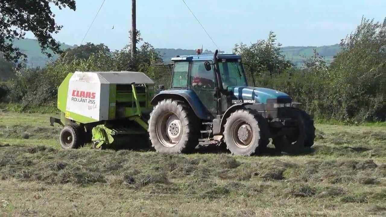 Silage 2011 Round Baling with New Holland 8360 and Claas R255.