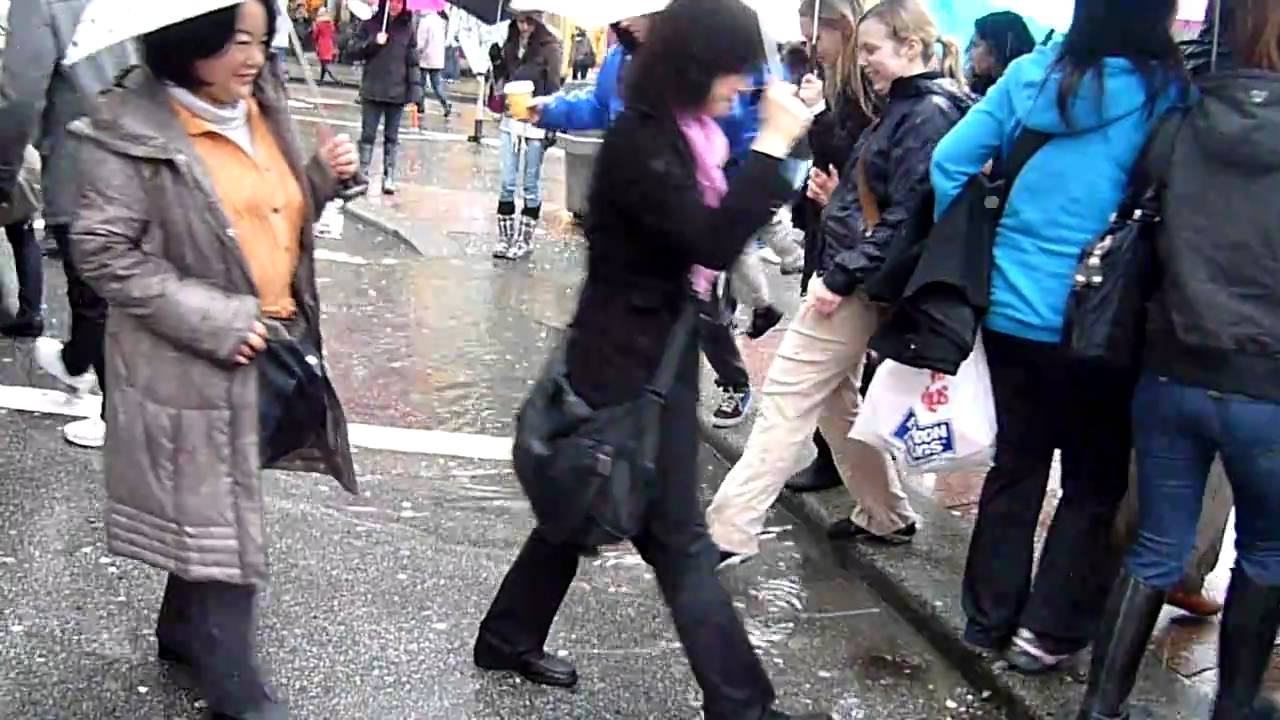 How do Vancouverites cross a large puddle?