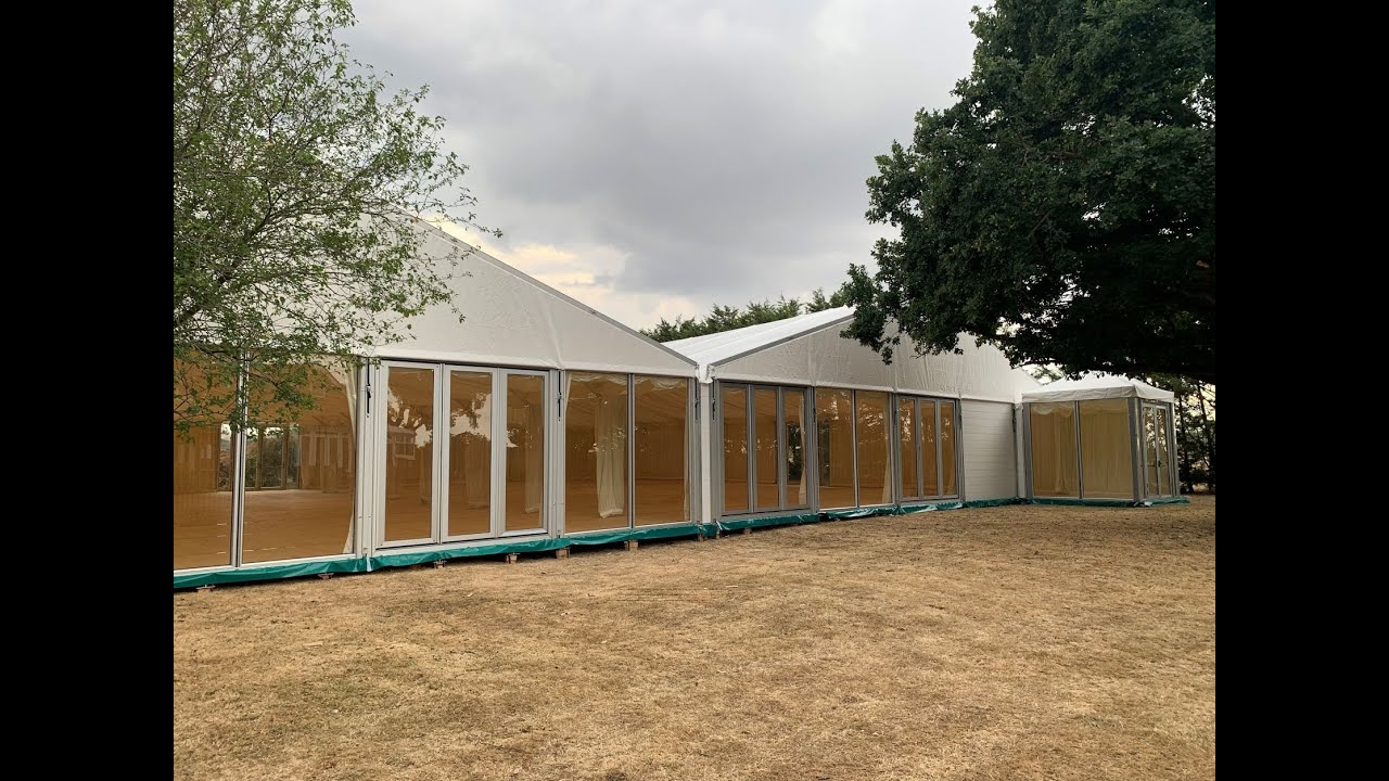 2 off E15 Hoecker Structures (UK) Ltd marquees with flooring system
