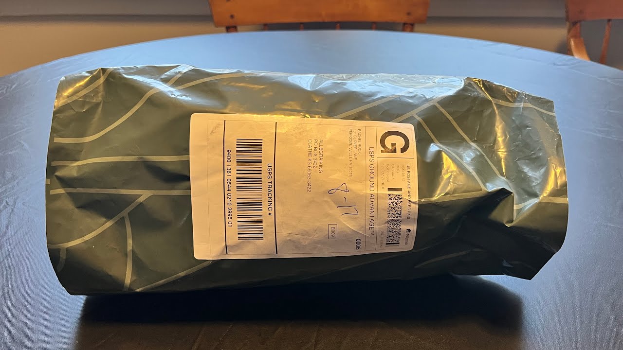Opening my package from Corviforms with Parrotlet Plush Pal inside