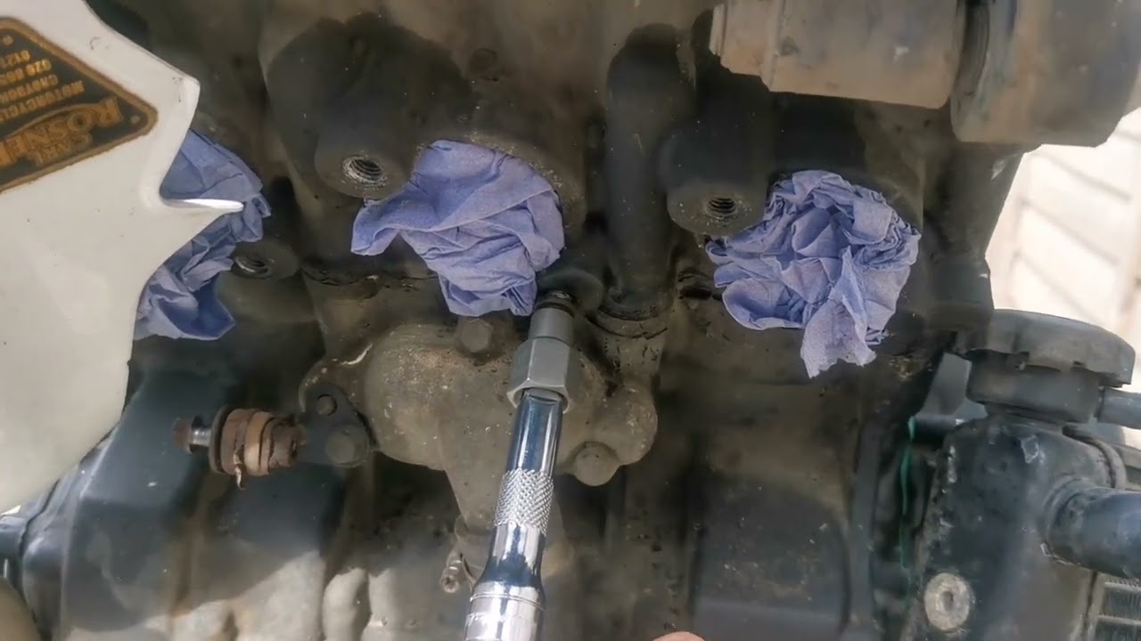 Exhaust header and radiator removal on Triumph Street Triple 675 r 2012