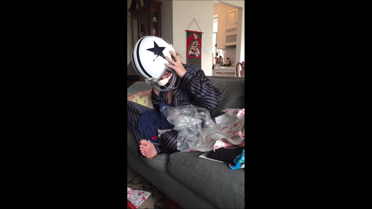Birthday girl gets her Tony Romo helmet stuck on her head!