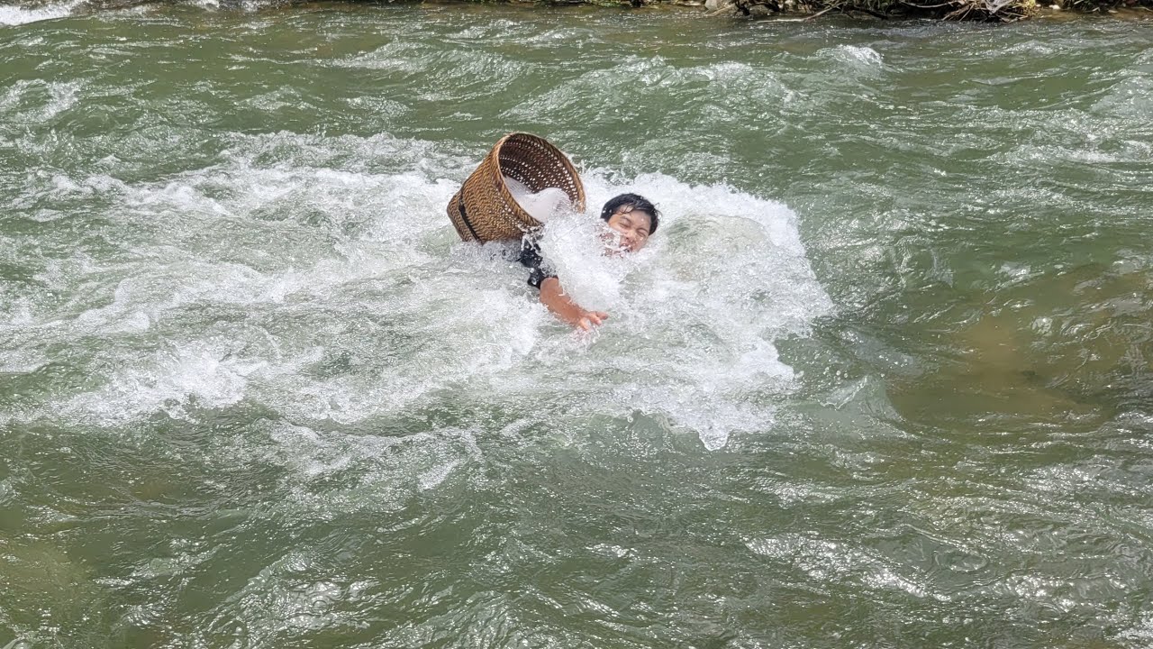 Fishing skills. Catching fish with hands. Young man swept away by water | Bình - Building new life