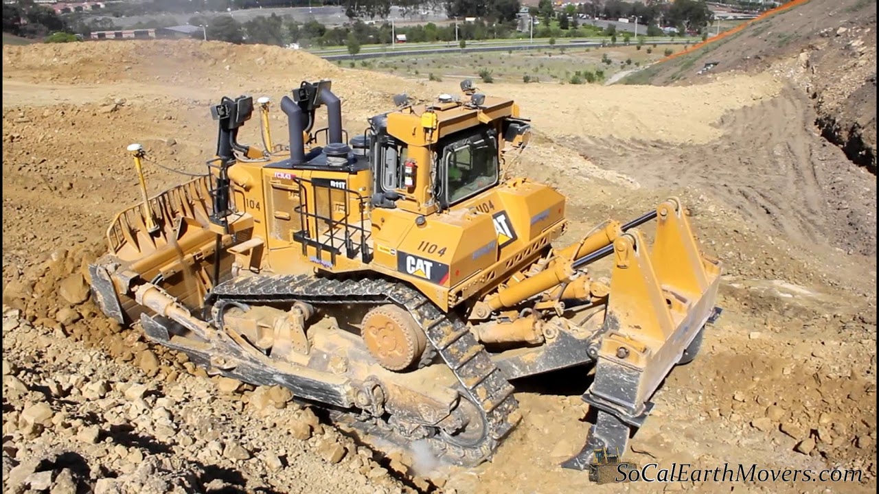 Some Big Cat's Working on Residential Grading Site