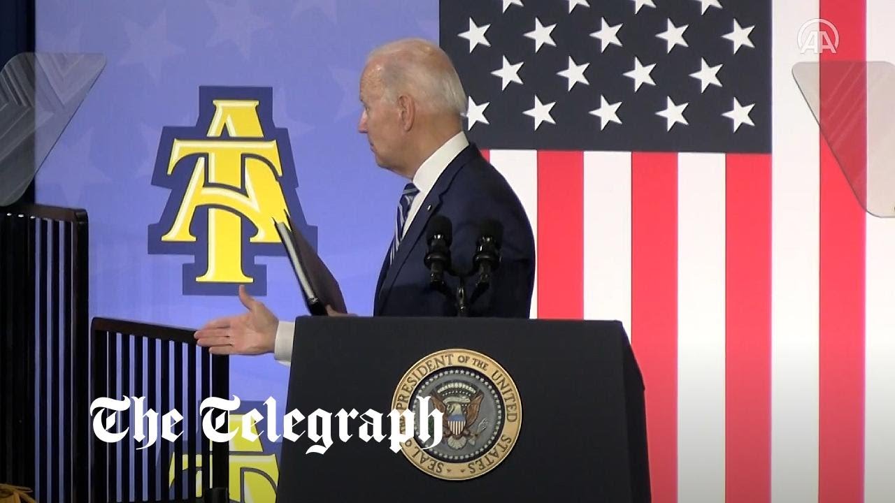 Moment Joe Biden shakes hands with thin air after speech