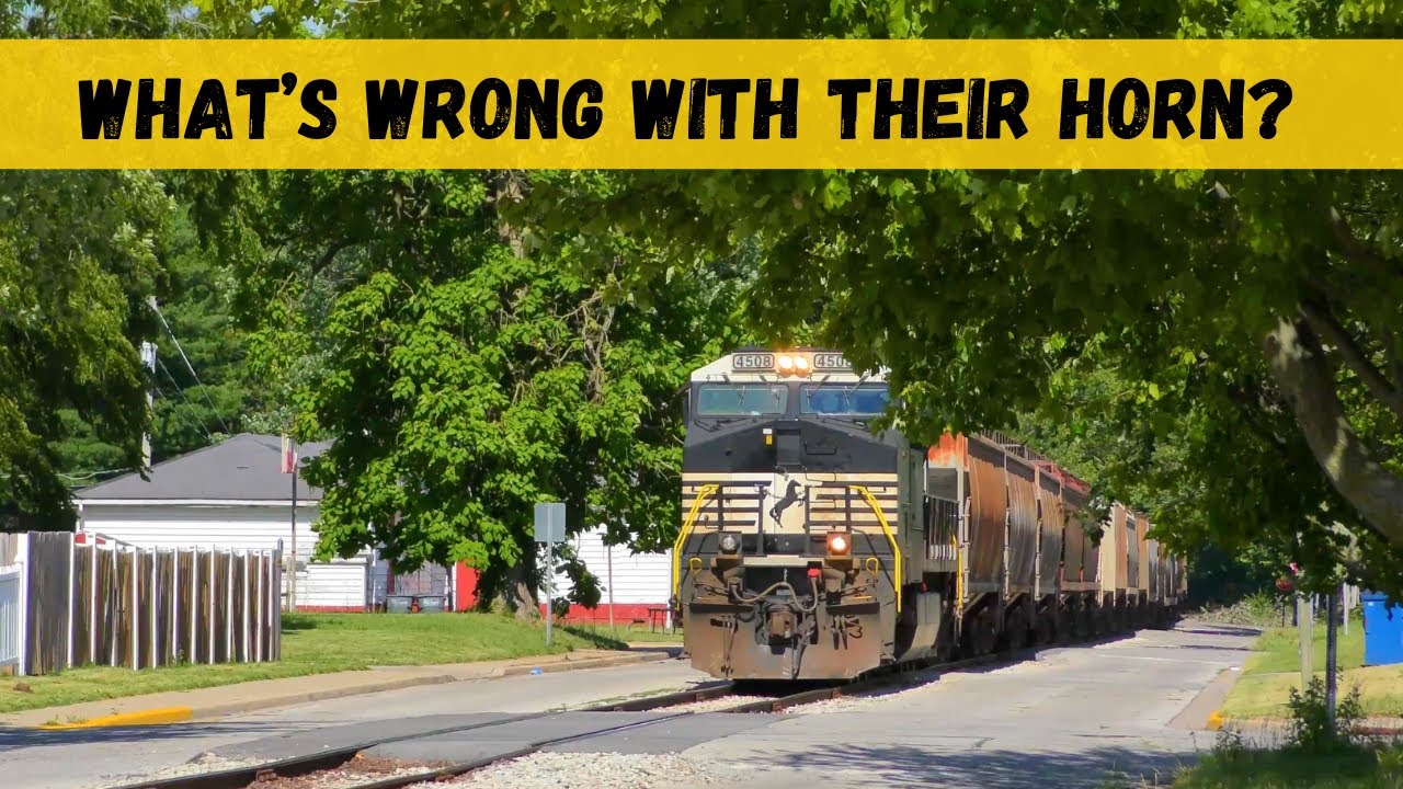 What's seems to be WRONG with their HORN???  as the train runs down the street-run!!!