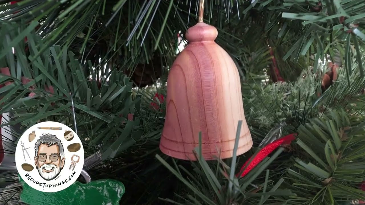 Turning a small bell from red cedar