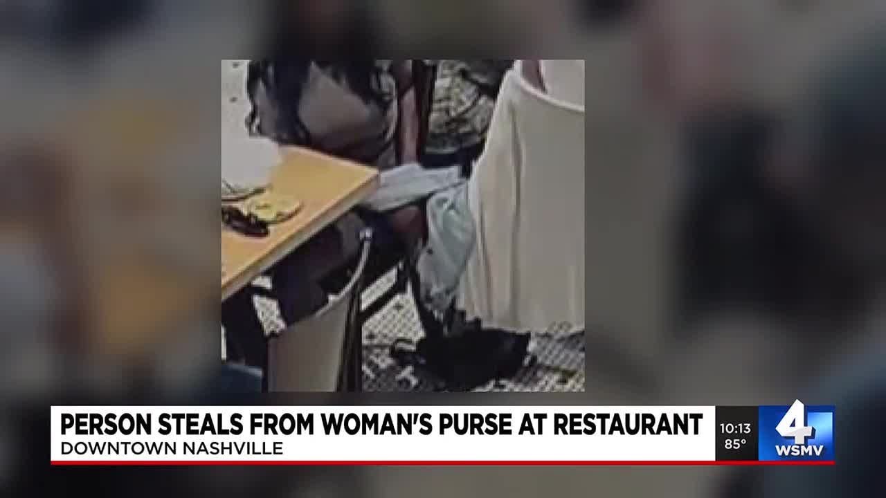 Person steals from woman's purse at restaurant