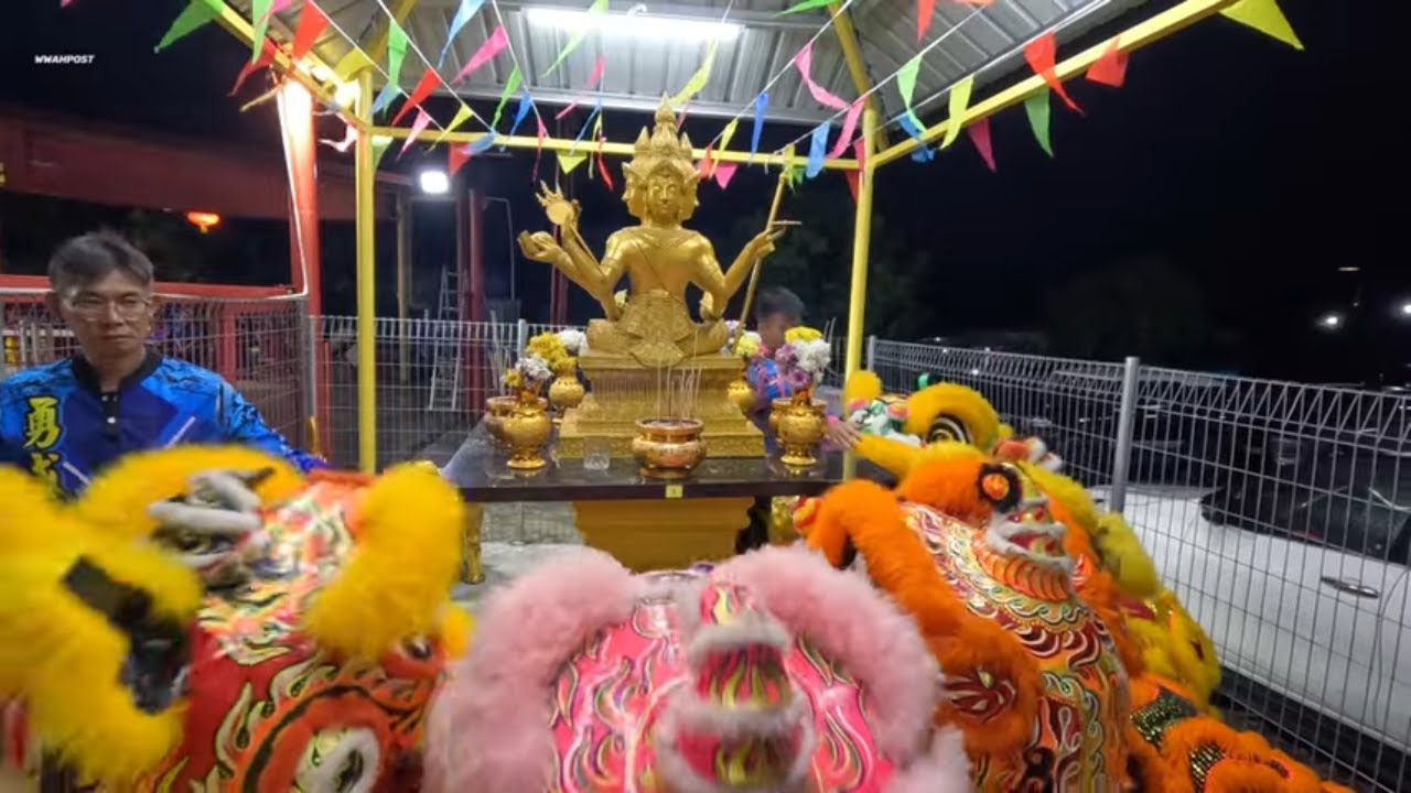 lion dance paying respect to Phra Phrom (4 Face God)