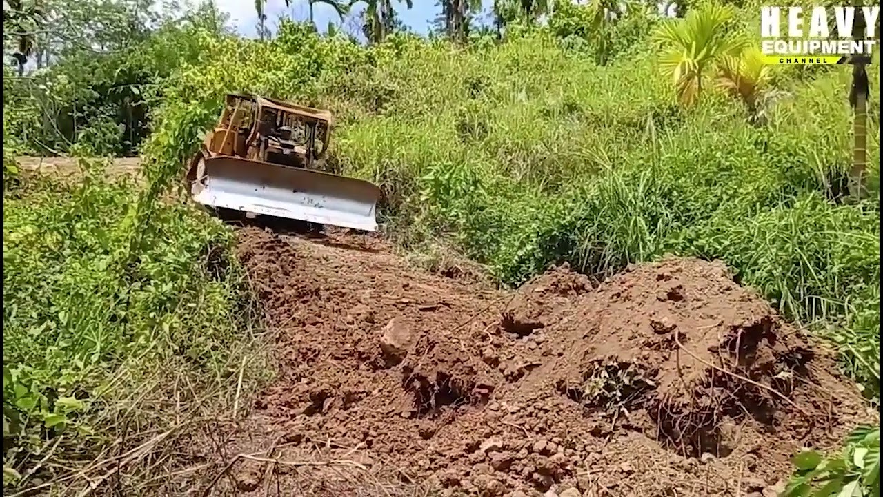Caterpillar D6R XL bulldozer operators are very experienced in working to widen plantation roads
