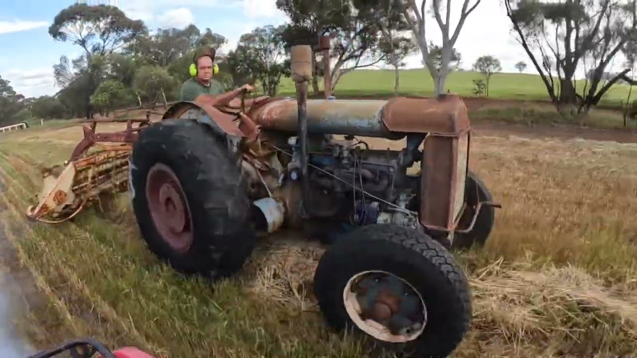 Raking hay using an 80 year old Fordson N tractor.