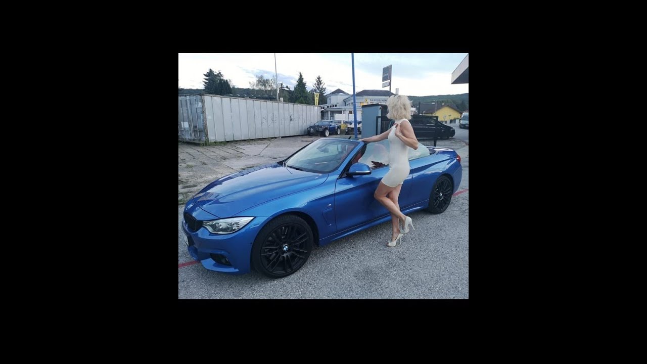 Latexmama's new car - presentet in a white Latexdress