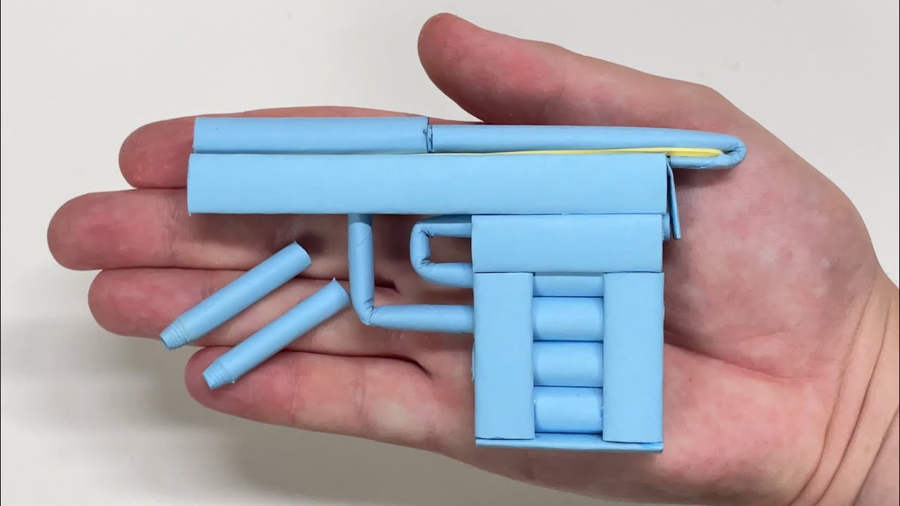 COMO FAZER UMA MINI ARMA DE PAPEL QUE ATIRA