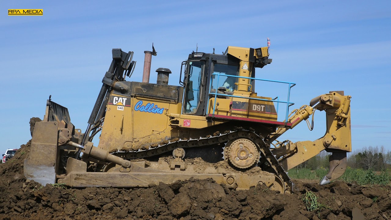 Caterpillar D9T pushing hard dirt