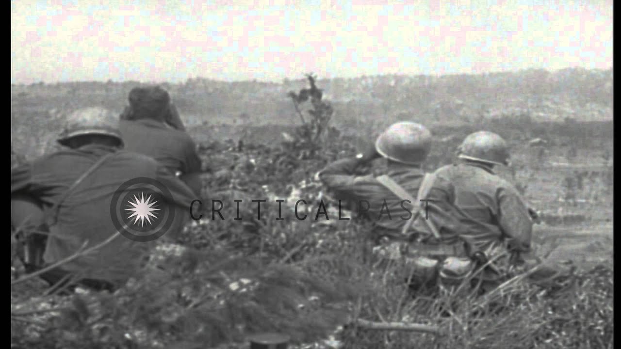 US 96th Division,381st Infantry soldiers advance behind a tank and wooded area in...HD Stock Footage