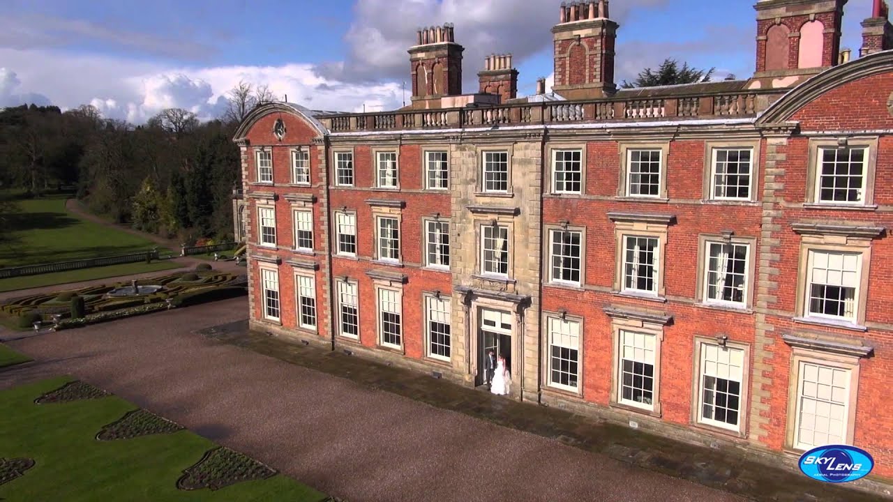 Different view of a bride and groom at a stately house