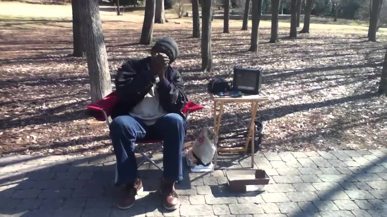 Homeless guy playing the Electric harmonica
