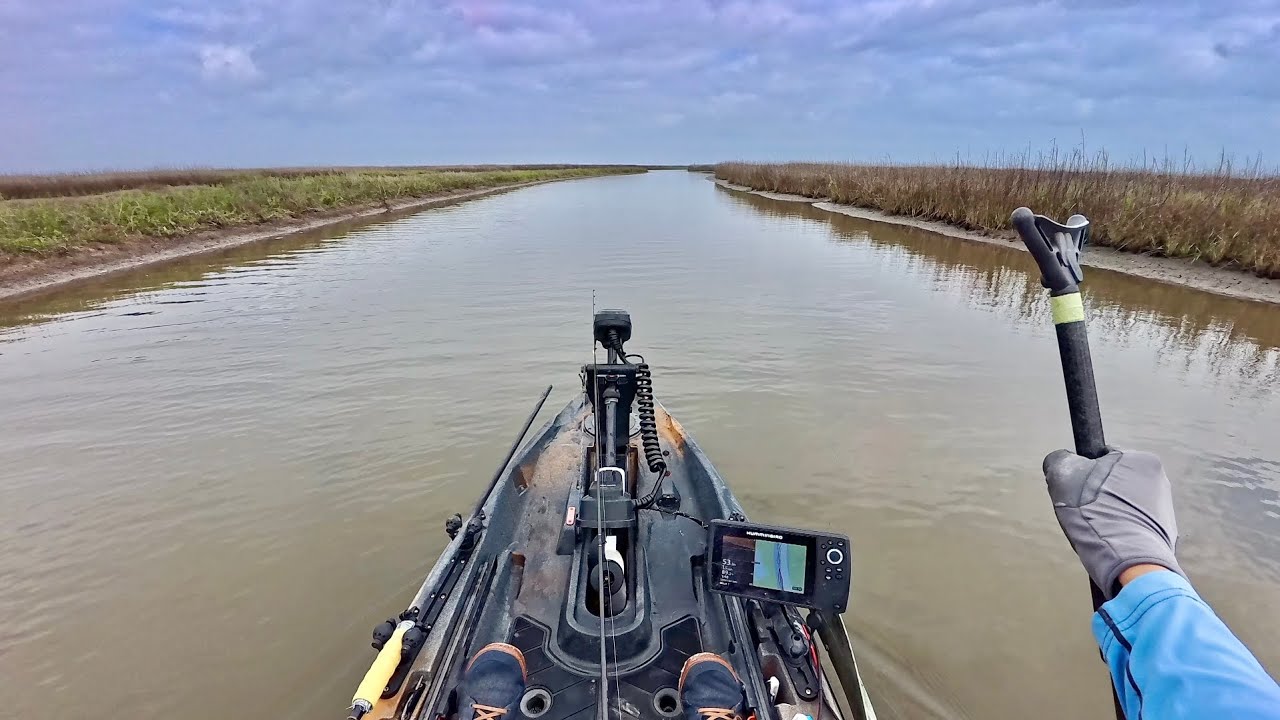 Kayak fishing 2 miles deep in a Texas marsh for food