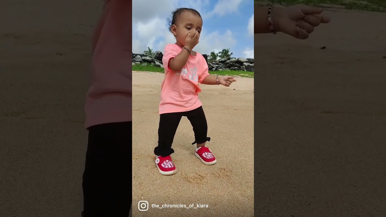 Cute baby eating sand
