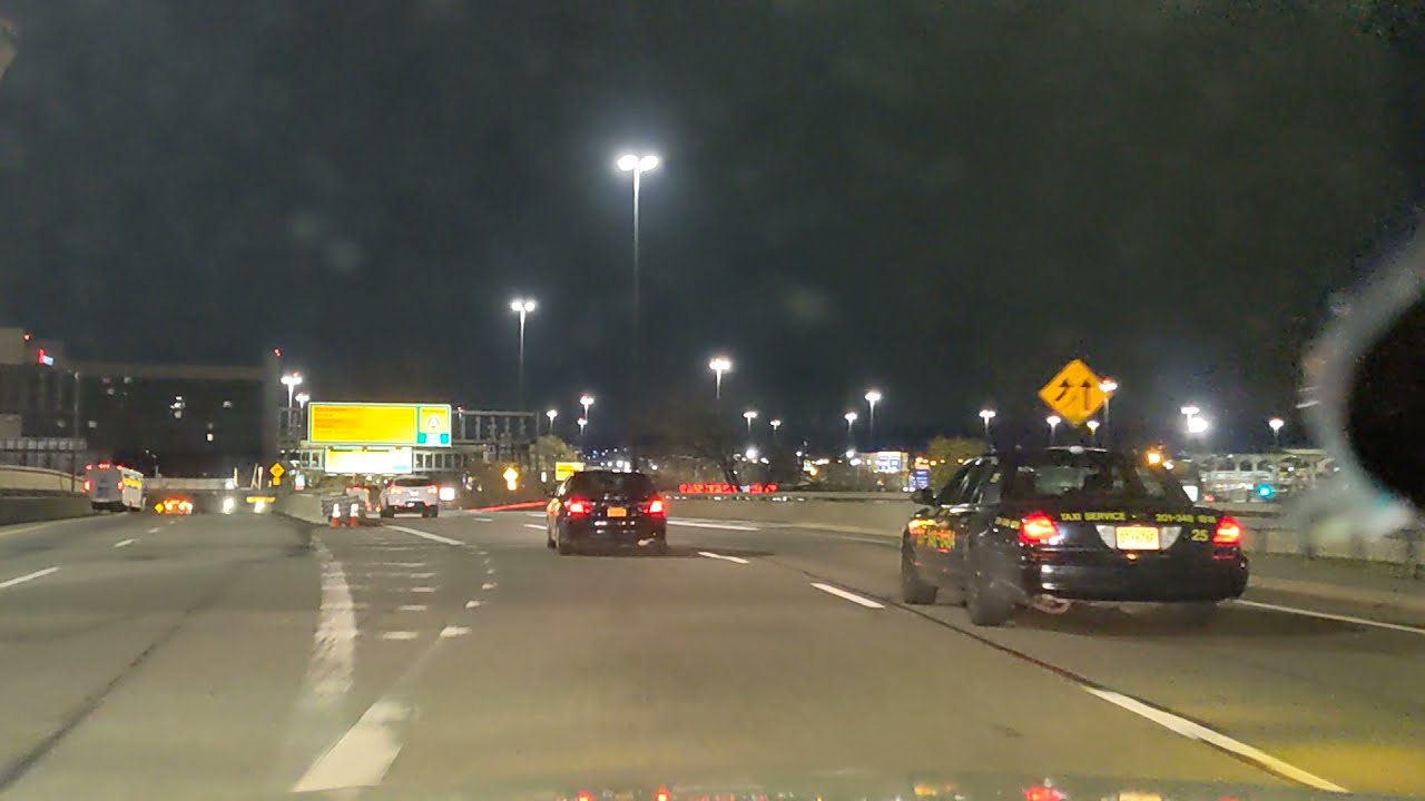 NJ Drive: Holland Tunnel + Pulaski Skyway + Newark Liberty Airport at night in a Crown Victoria