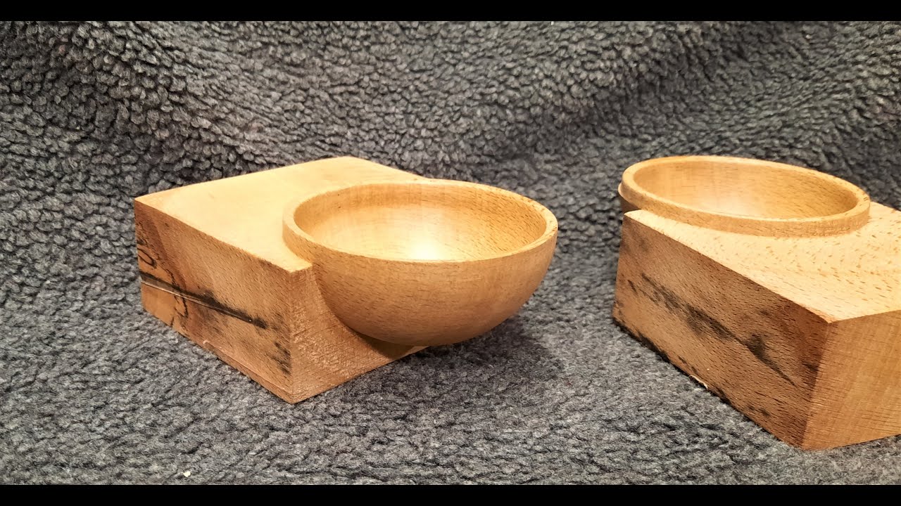Wood turning an emerging bowl.