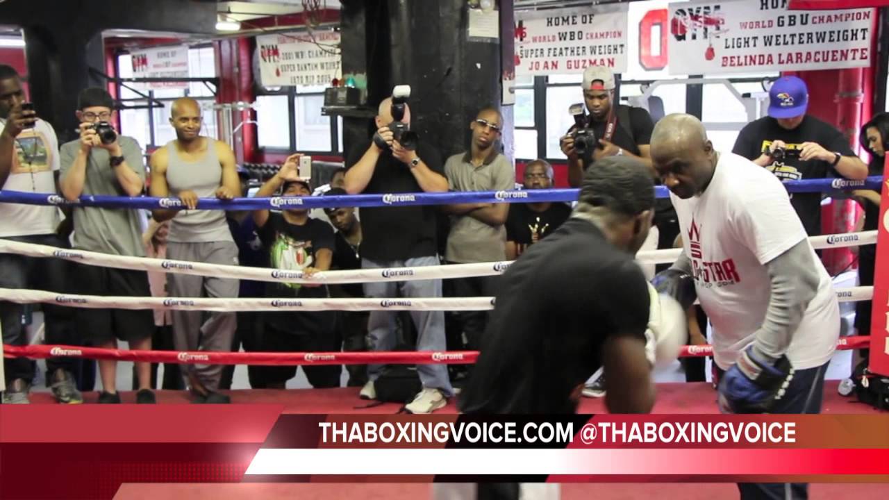 ADRIEN BRONER AND TRAINER MIKE STAFFORD DOING MITT WORK
