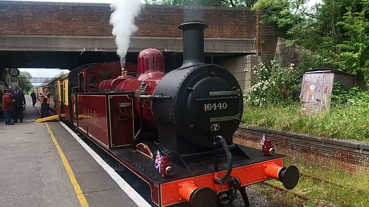 steam train at Butterley with tones and steam, rails, staff, signals, carriages, passengers