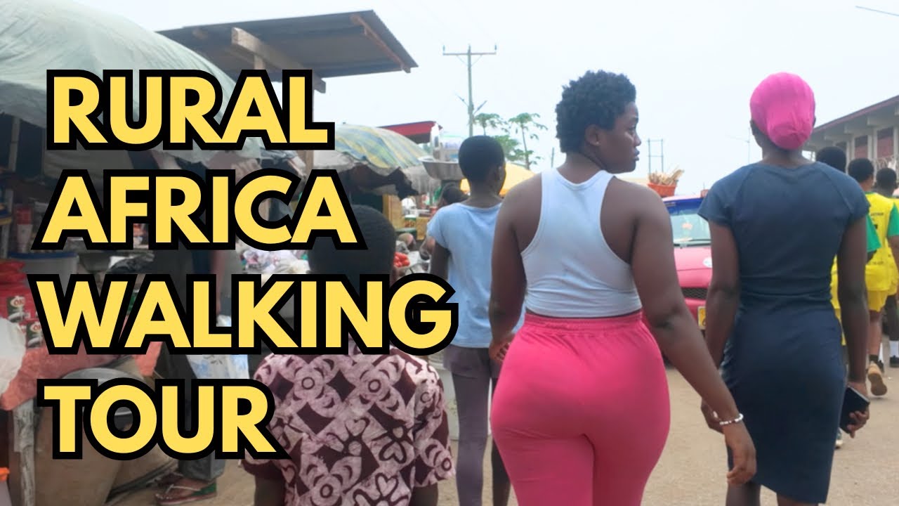 WALKING THROUGH A LIVELY STREET IN ELMINA GHANA