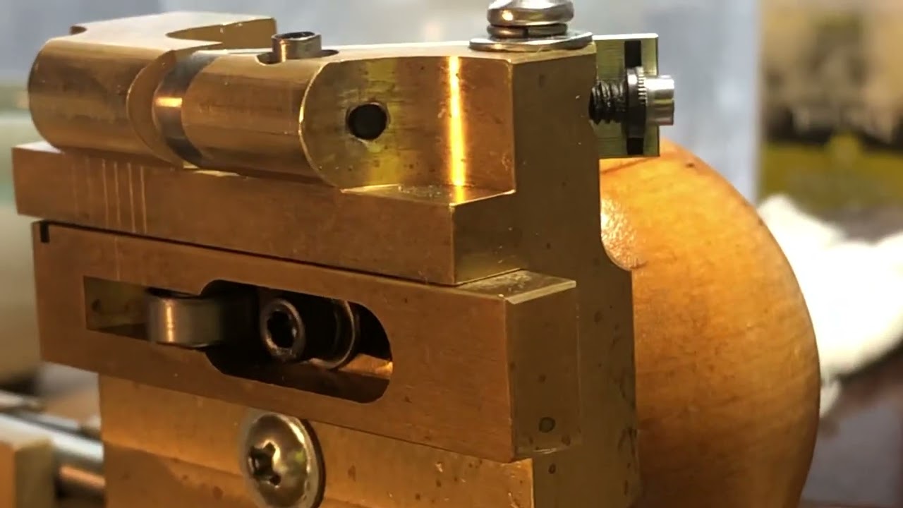 Adjusting the blade position in an RDG oboe gouging machine.