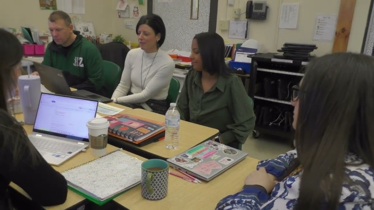 Grade Band Team opening their PLC meeting.