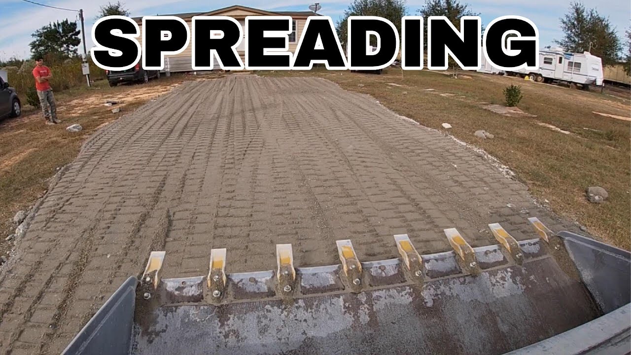 CAT 259D skid steer spreading gravel